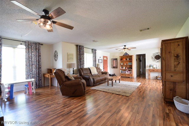 104527 S 4670th Rd, Sallisaw, OK 74955 - living area with ceiling fan, a textured ceiling, and wood finished floors