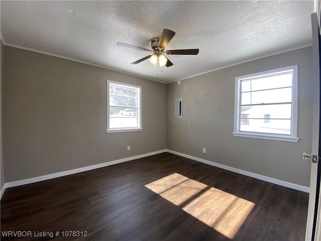 unfurnished room featuring crown molding, dark wood-type flooring, a textured ceiling, and ceiling fan