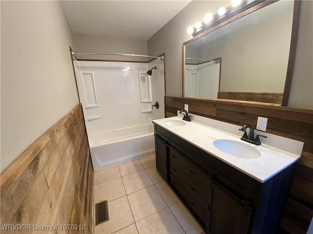 bathroom with shower / tub combination, vanity, and tile patterned flooring