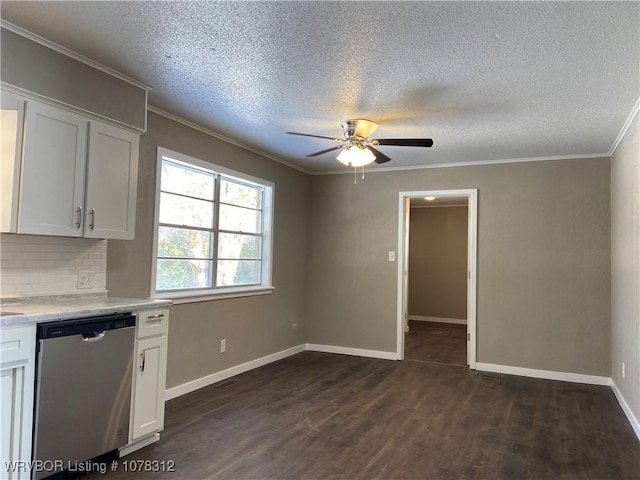 kitchen with tasteful backsplash, white cabinets, dark hardwood / wood-style flooring, and dishwasher