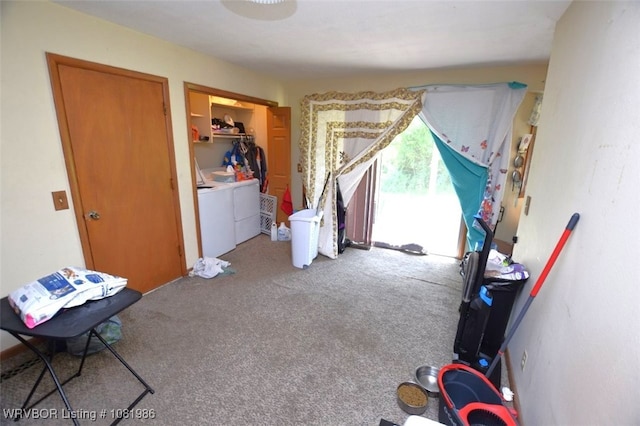 807 S 2nd St, Stilwell, OK 74960 - bedroom featuring independent washer and dryer, carpet, access to exterior, and a closet