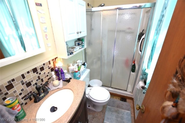 807 S 2nd St, Stilwell, OK 74960 - bathroom featuring a shower stall, vanity, and tasteful backsplash