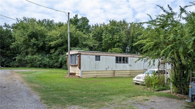 view of outbuilding with a lawn