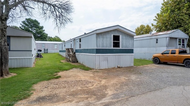 view of property exterior featuring a yard