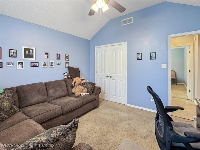 living room with light colored carpet, vaulted ceiling, and ceiling fan