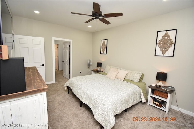 carpeted bedroom with ceiling fan