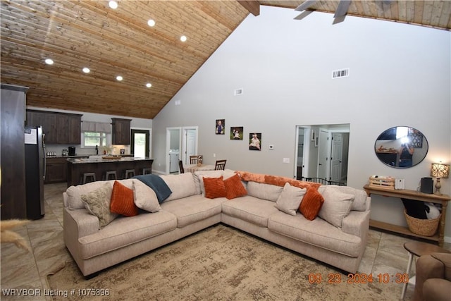 tiled living room with beamed ceiling, high vaulted ceiling, and wooden ceiling