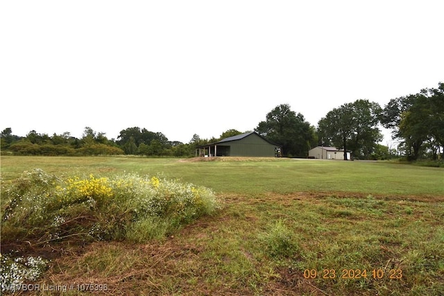 view of yard with a rural view