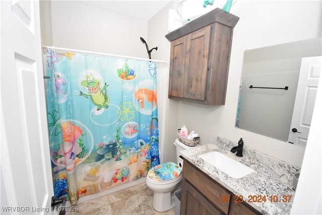 full bathroom with vanity, toilet, and shower / bath combo with shower curtain