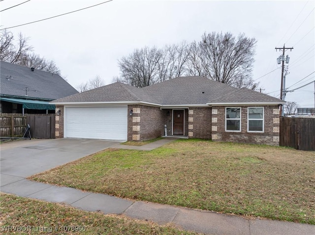 ranch-style home with a garage and a front lawn