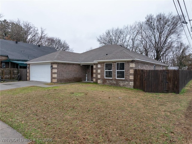 single story home featuring a garage and a front yard