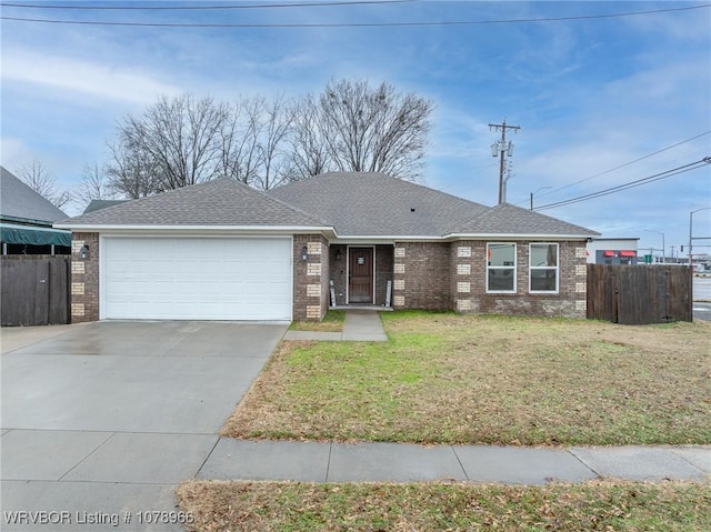 ranch-style home with a garage and a front lawn