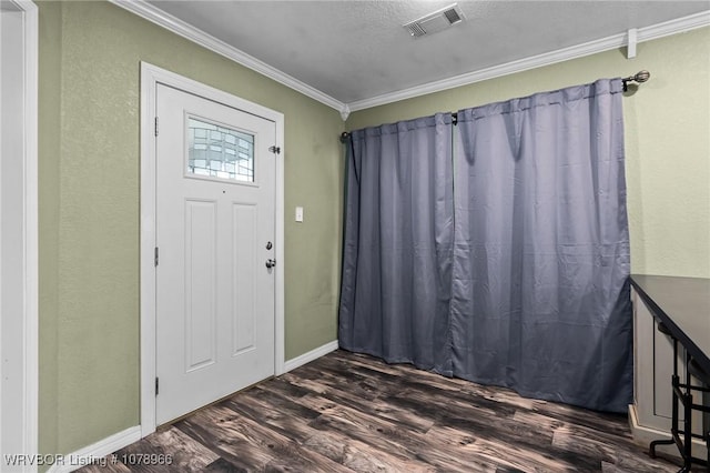 foyer entrance with dark hardwood / wood-style flooring and crown molding