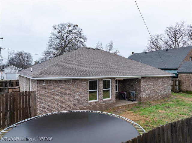 rear view of property featuring a patio area