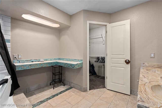 bathroom with vanity and tile patterned floors