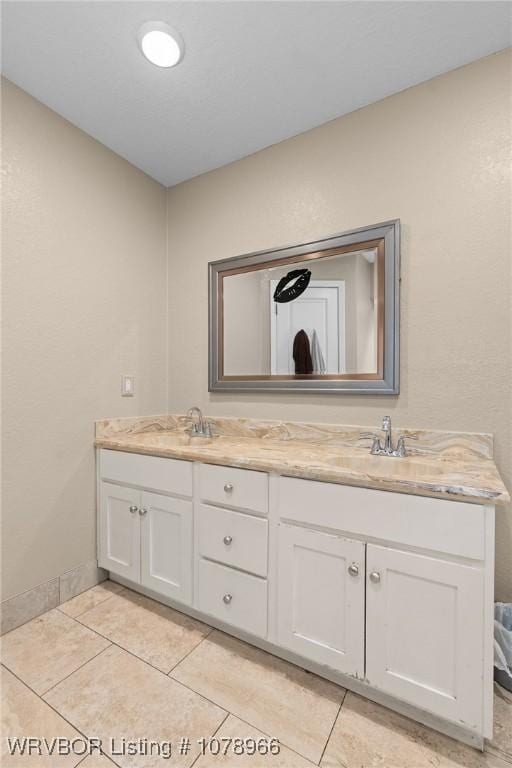 bathroom featuring tile patterned floors and vanity