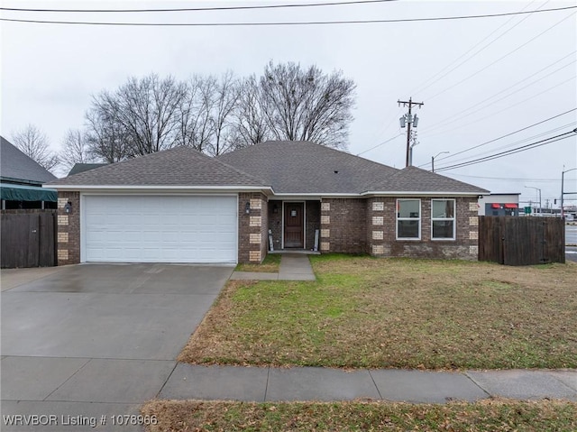 ranch-style home with a garage and a front yard