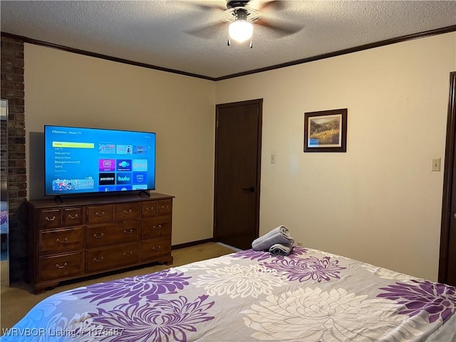 bedroom featuring crown molding, ceiling fan, carpet, and a textured ceiling