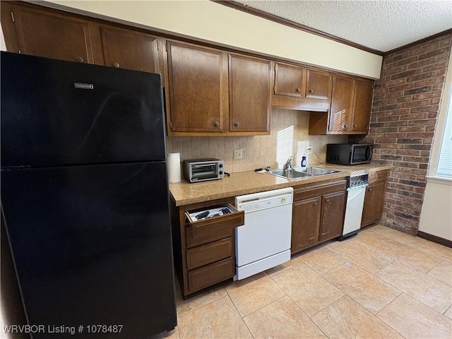 kitchen with sink, black fridge, tasteful backsplash, a textured ceiling, and white dishwasher