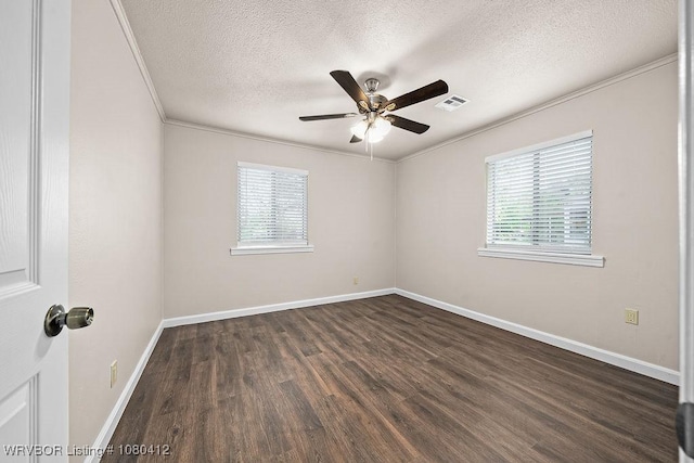 unfurnished room with dark wood-style floors, baseboards, a textured ceiling, and visible vents