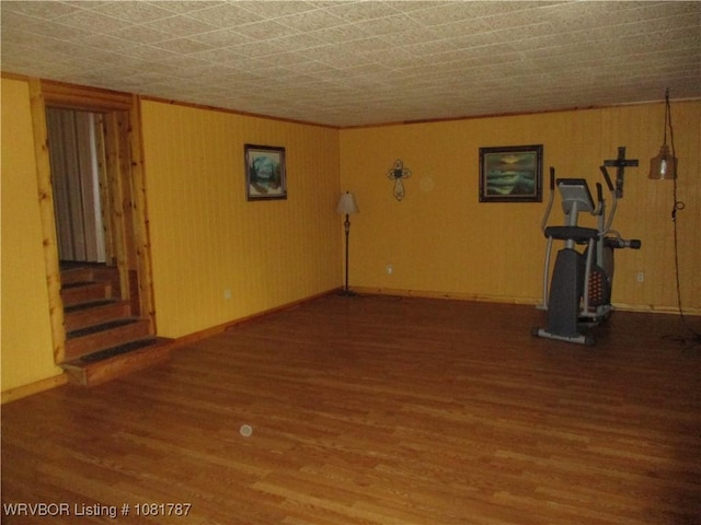 15632 Pink Twist Rd, Ozark, AR 72949 - empty room with wood finished floors, stairs, and wooden walls