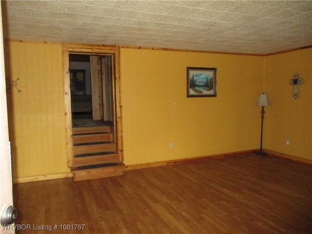 15632 Pink Twist Rd, Ozark, AR 72949 - unfurnished room with wood finished floors, stairs, and ornamental molding