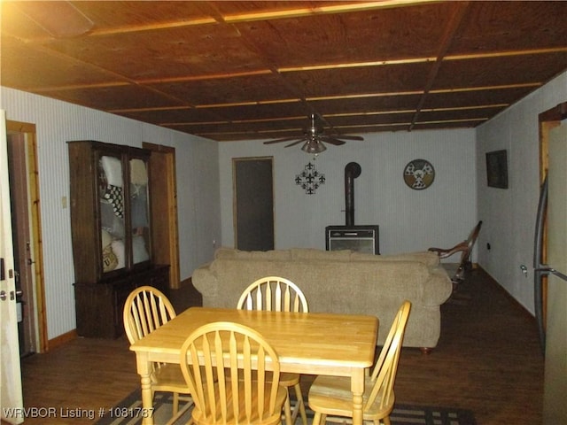 15632 Pink Twist Rd, Ozark, AR 72949 - dining area featuring wood finished floors, a wood stove, and a ceiling fan