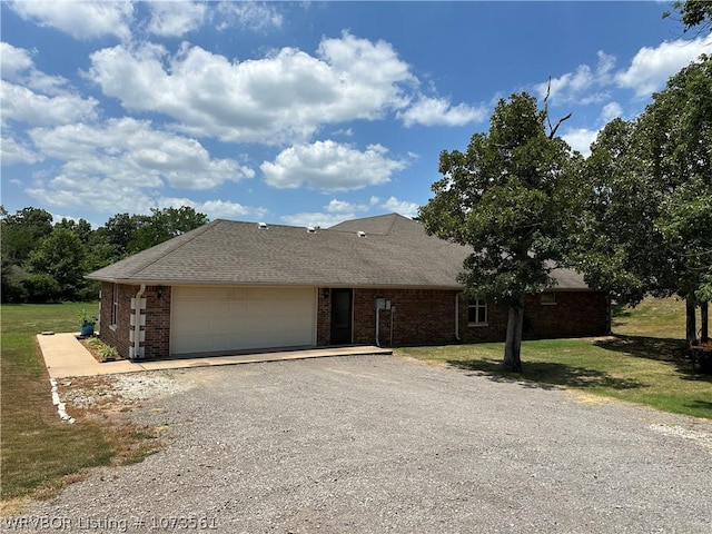 view of front of home featuring a front lawn and a garage