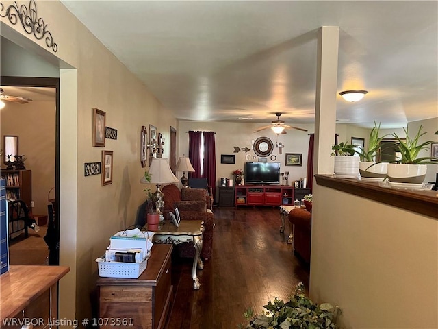 interior space with dark hardwood / wood-style floors and ceiling fan