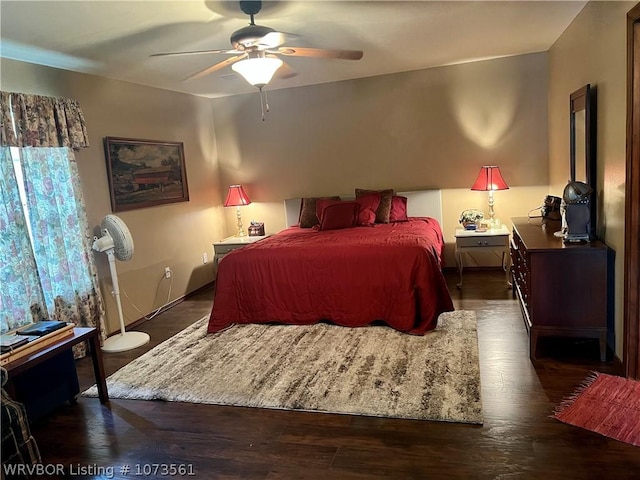 bedroom with ceiling fan and dark hardwood / wood-style floors