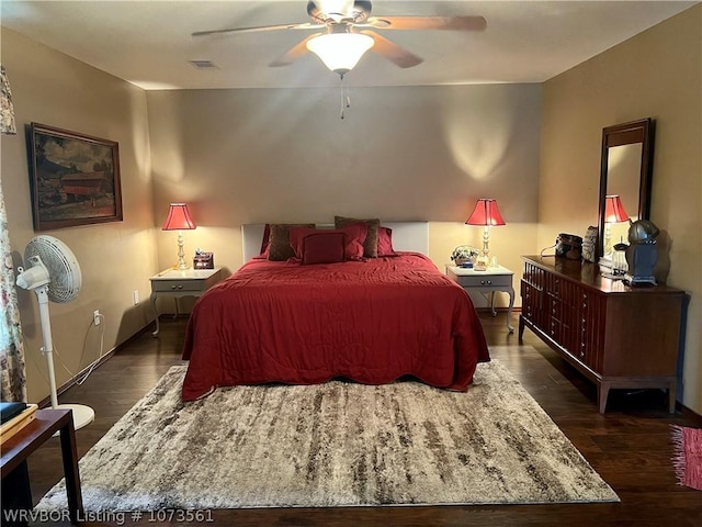 bedroom featuring ceiling fan and dark hardwood / wood-style flooring