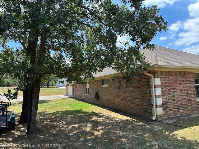 view of property exterior featuring a lawn