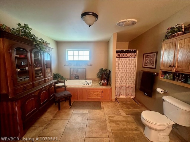 bathroom with tile patterned floors, independent shower and bath, and toilet