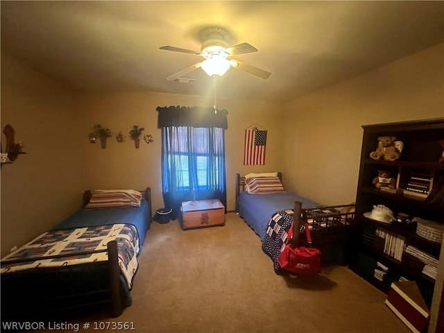 bedroom featuring ceiling fan and carpet floors