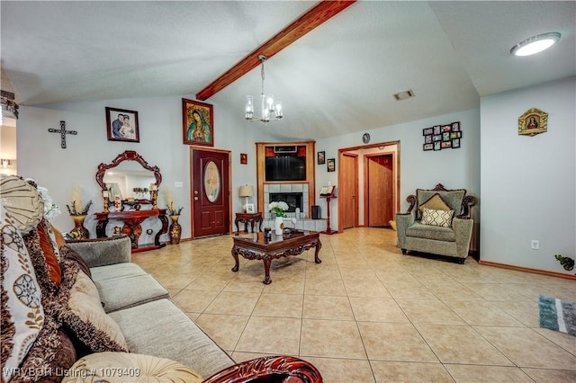 living area with vaulted ceiling with beams, a fireplace, visible vents, an inviting chandelier, and tile patterned flooring