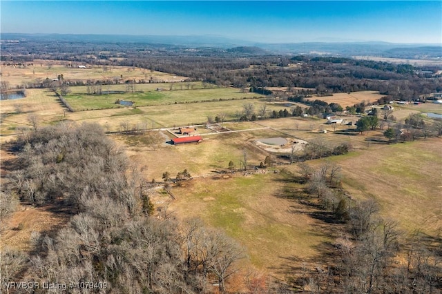 birds eye view of property with a rural view