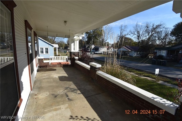 view of patio featuring a porch