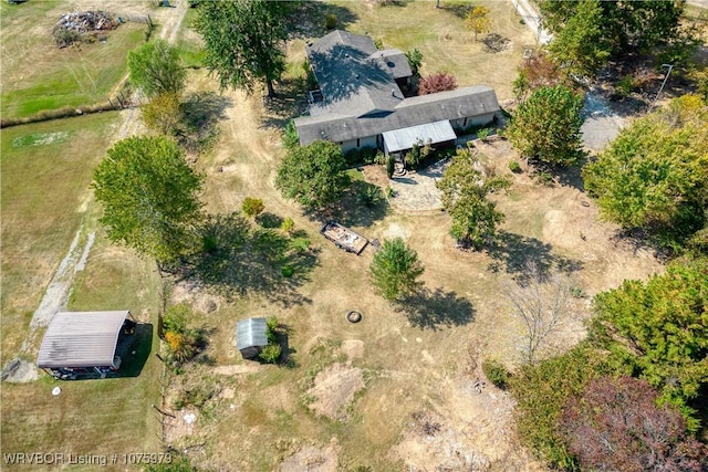 birds eye view of property with a rural view