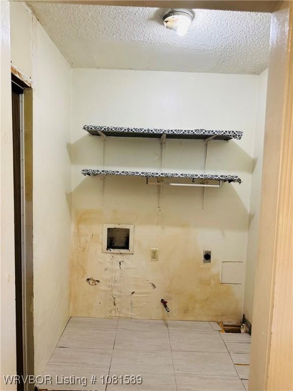 1301 9th St, Barling, AR 72923 - laundry room with hookup for an electric dryer, washer hookup, and a textured ceiling
