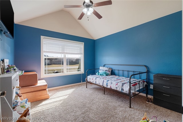 carpeted bedroom featuring vaulted ceiling, baseboards, and ceiling fan