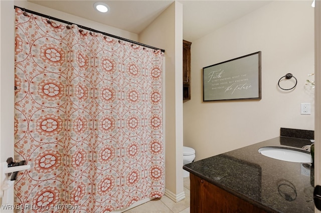 bathroom with curtained shower, toilet, vanity, and tile patterned flooring