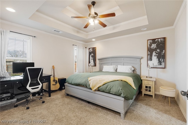 bedroom featuring visible vents, carpet flooring, crown molding, and a raised ceiling