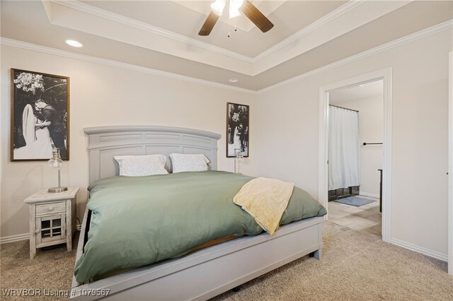 bedroom with a raised ceiling, carpet flooring, recessed lighting, and ornamental molding