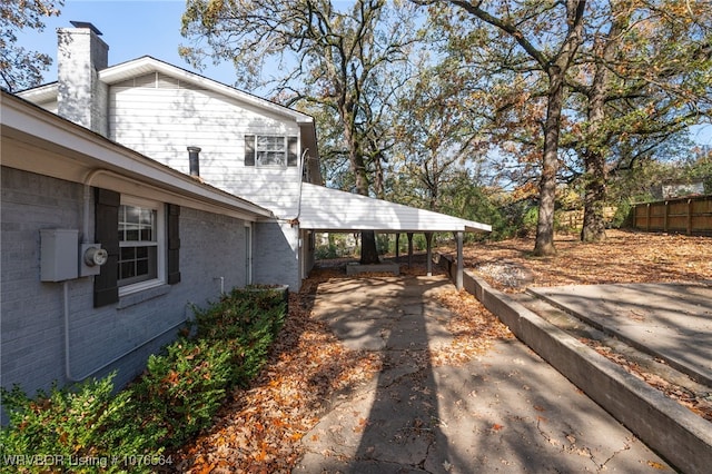 view of property exterior featuring a carport