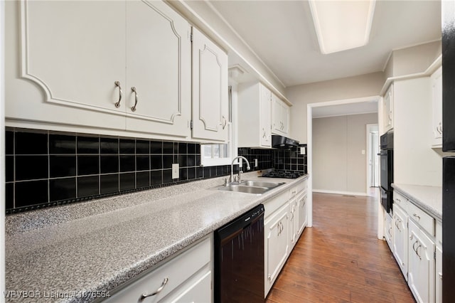 kitchen featuring decorative backsplash, dark wood-type flooring, sink, black appliances, and white cabinets