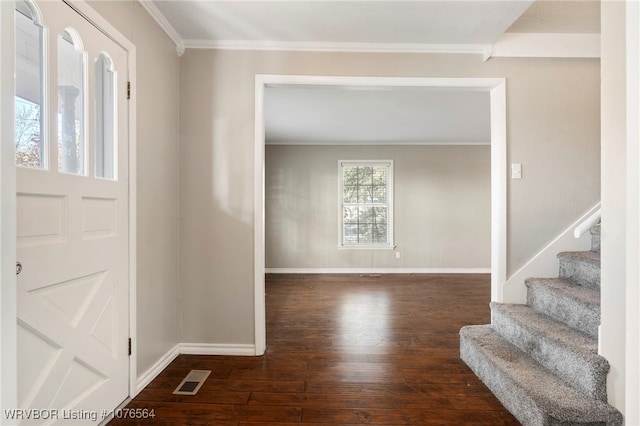 foyer with dark hardwood / wood-style floors and ornamental molding