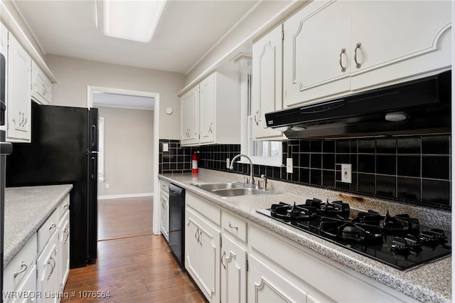 kitchen featuring black appliances, dark hardwood / wood-style flooring, white cabinets, and sink