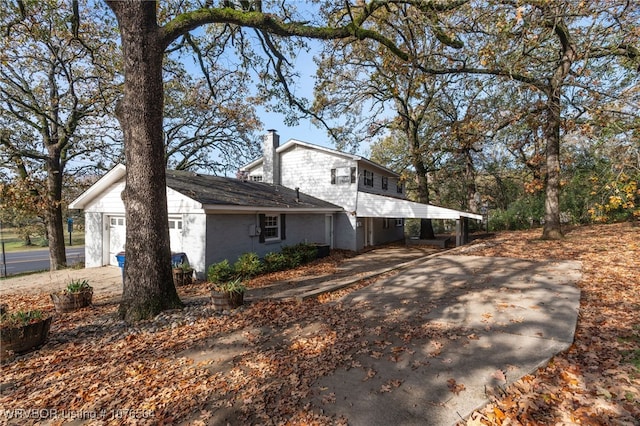 view of side of home featuring a carport