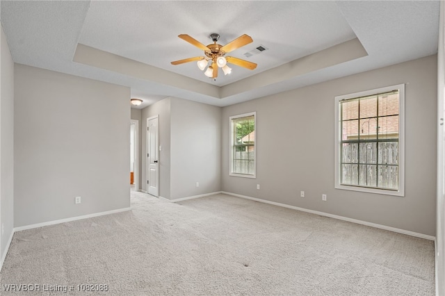 2419 Shealei Cir, Alma, AR 72921 - carpeted spare room featuring a raised ceiling and a ceiling fan