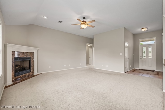 2419 Shealei Cir, Alma, AR 72921 - unfurnished living room featuring a ceiling fan, light carpet, a fireplace, and vaulted ceiling